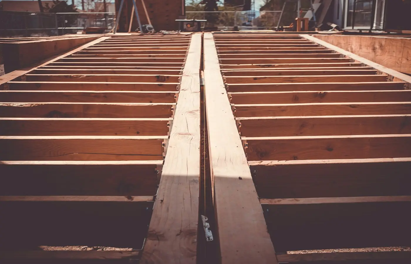 Deck framing with joists and a central beam before decking (stock photo)