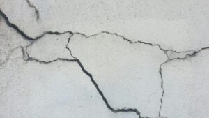 foundation crack inspection (stock photo)