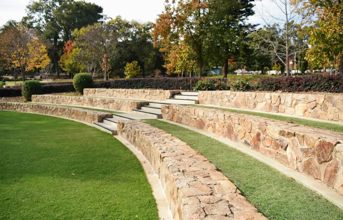 A row of stone steps sitting on top of a lush green field (stock photo)
