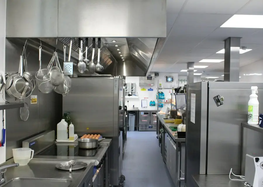 Commercial restaurant kitchen with hood and stainless equipment (stock photo)